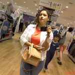 Stylish woman shopping in clothing store