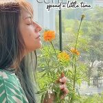 Young woman enjoying nature with plants