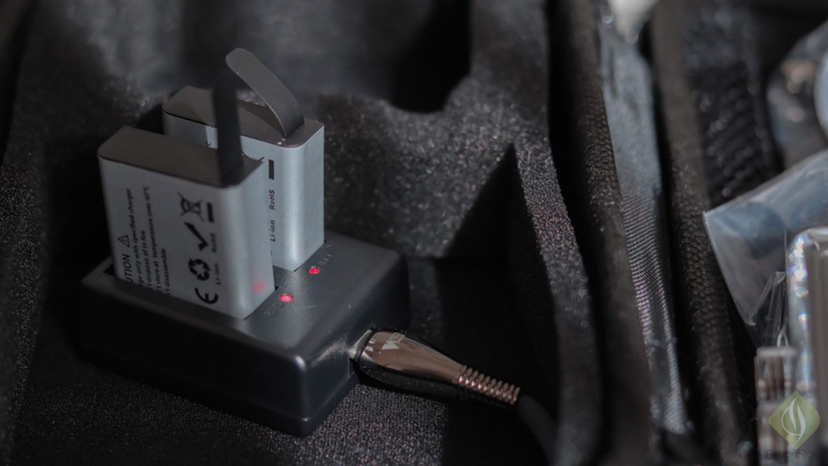 Close-up of lumos action camera accessories and charging equipment in a travel bag.