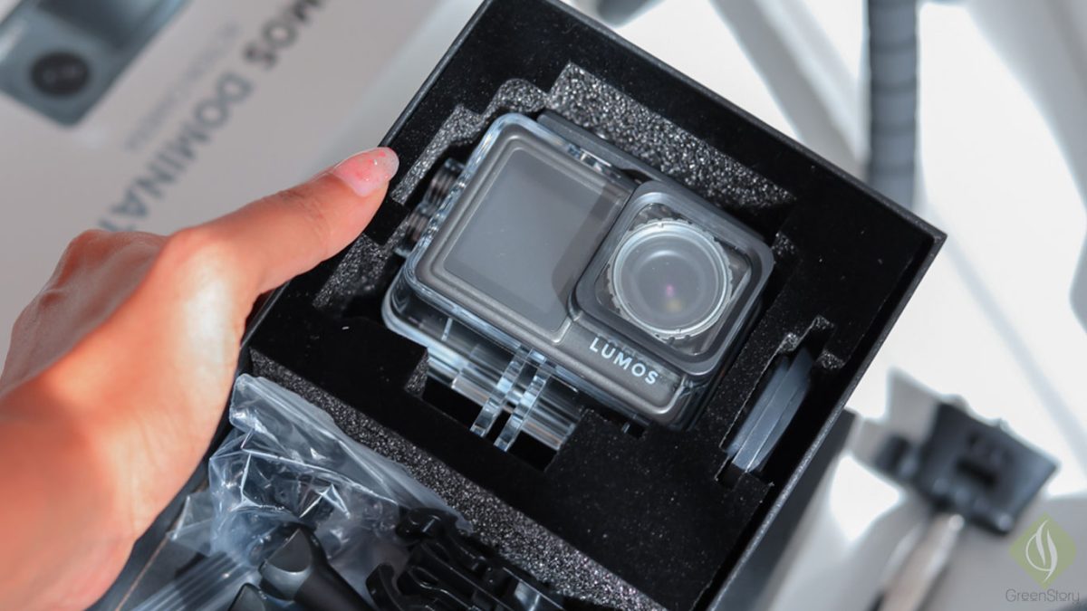 LUMOS action camera in packaging with protective case and accessories.